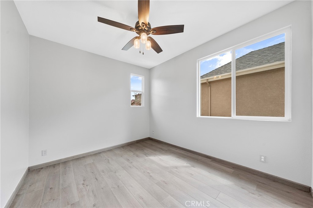 311 Nimbus Tustin, CA 92782 - Photo 24 of 39 an empty room with a window and a ceiling fan