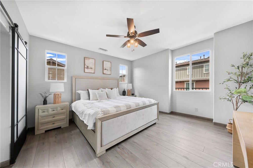 311 Nimbus Tustin, CA 92782 - Photo 29 of 39 a bedroom with a large bed and a window