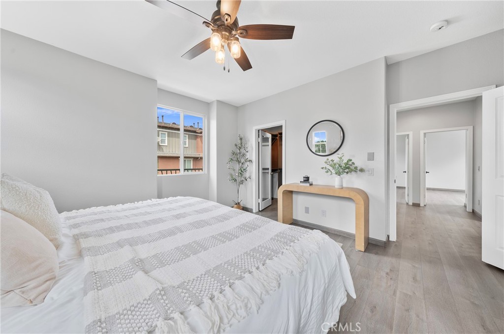 311 Nimbus Tustin, CA 92782 - Photo 31 of 39 a bedroom with a bed and a chandelier