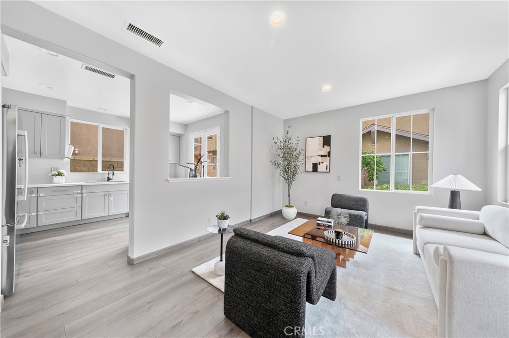 311 Nimbus Tustin, CA 92782 - Photo 4 of 39 a living room with furniture and windows