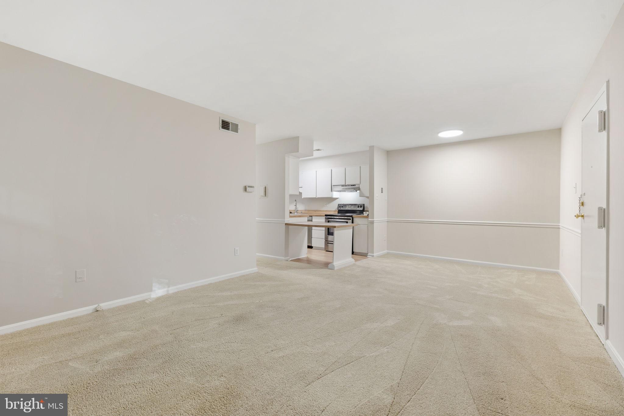 5817 Rexford Drive, Unit 798 Springfield, VA 22152 - Photo 6 of 23 a view of empty room with kitchen