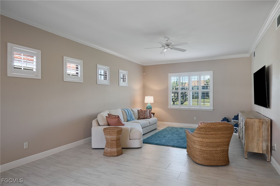 14101 Bently Circle Fort Myers, FL 33912 - Photo 12 of 29 a living room with furniture and a flat screen tv