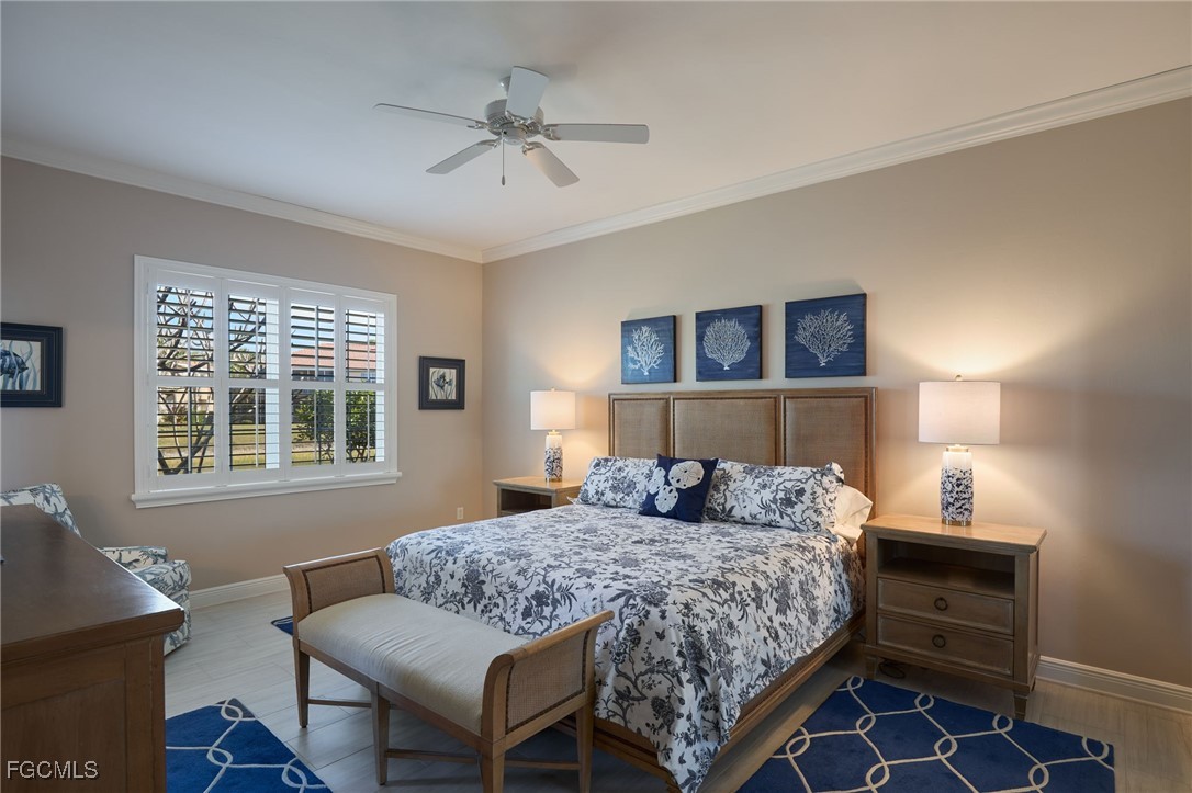 14101 Bently Circle Fort Myers, FL 33912 - Photo 13 of 29 a bedroom with a bed and a window