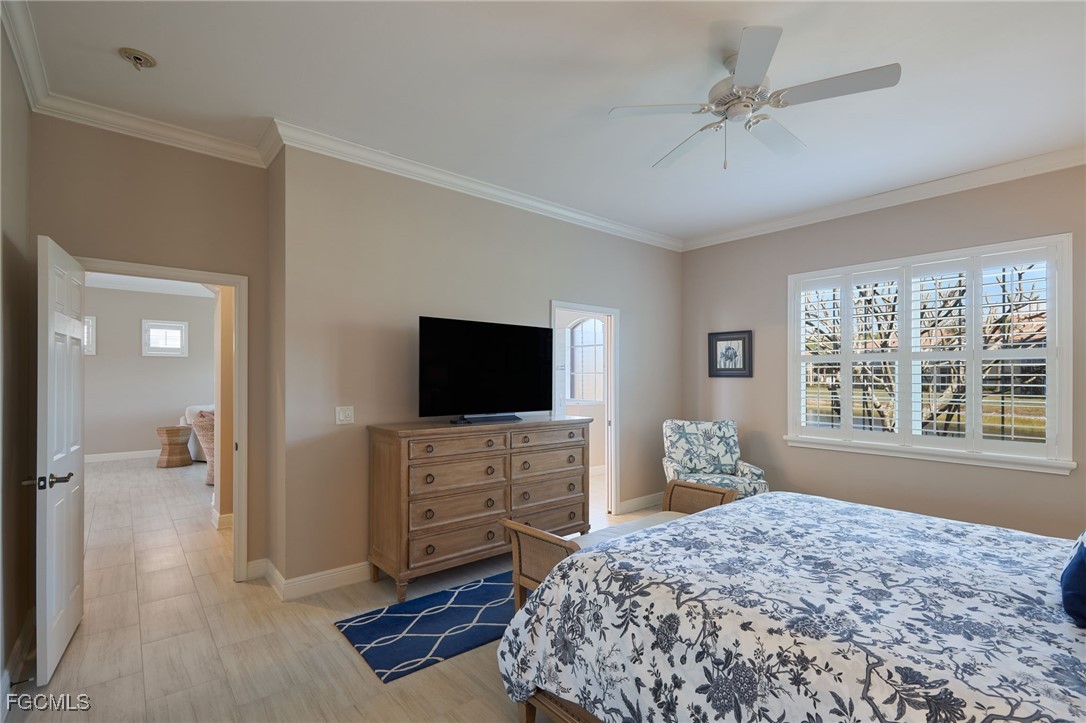 14101 Bently Circle Fort Myers, FL 33912 - Photo 14 of 29 a bedroom with a bed and a flat screen television
