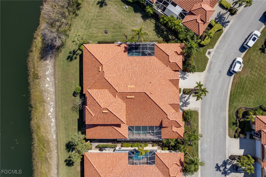 14101 Bently Circle Fort Myers, FL 33912 - Photo 28 of 29 an aerial view of a house with a yard and a large tree