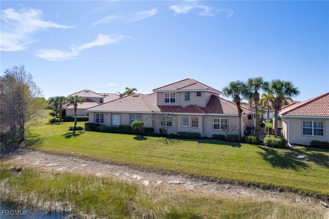 14101 Bently Circle Fort Myers, FL 33912 - Photo 29 of 29 a view of a big house with a big yard and large trees