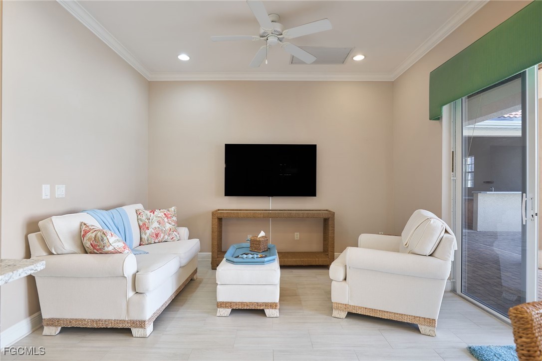 14101 Bently Circle Fort Myers, FL 33912 - Photo 6 of 29 a living room with furniture and a flat screen tv