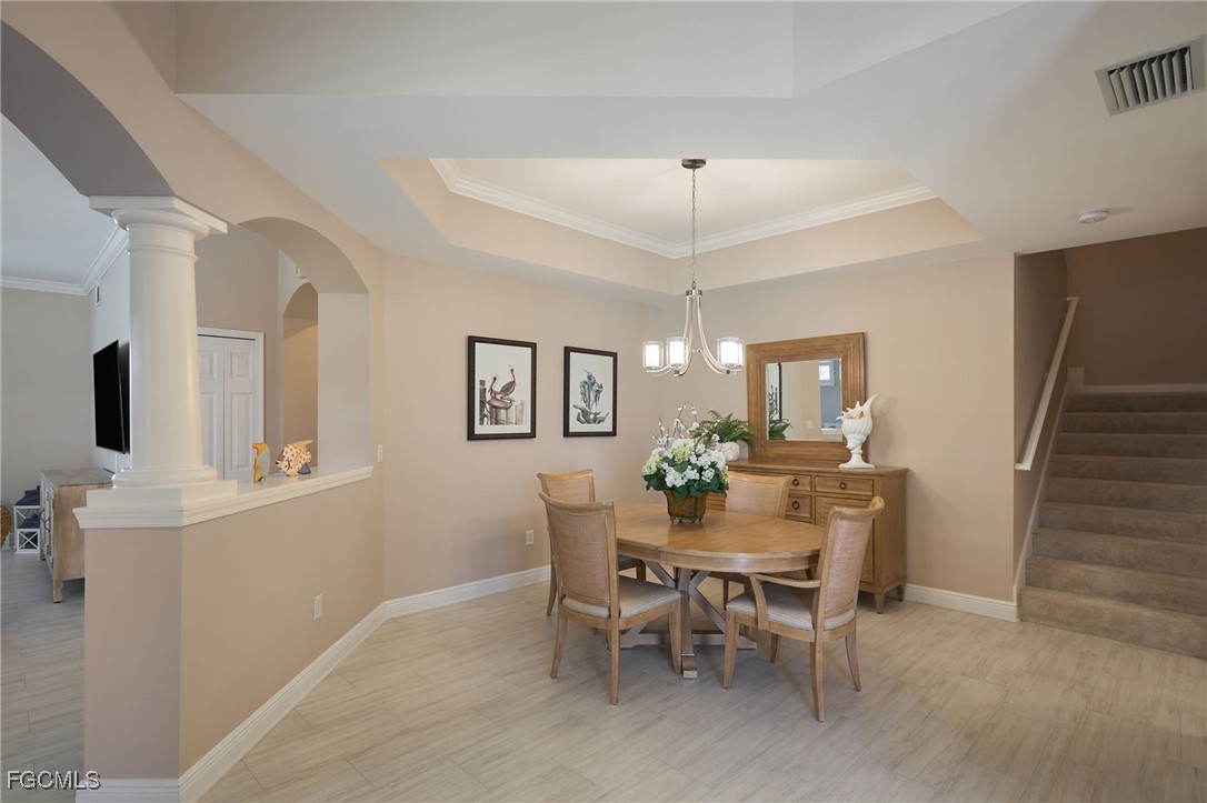 14101 Bently Circle Fort Myers, FL 33912 - Photo 9 of 29 a view of a dining room with furniture and chandelier