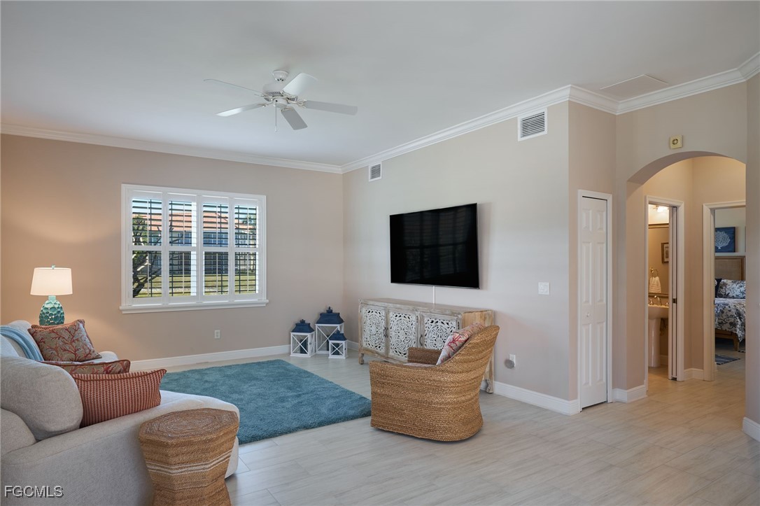 14101 Bently Circle Fort Myers, FL 33912 - Photo 10 of 29 a living room with furniture and a flat screen tv