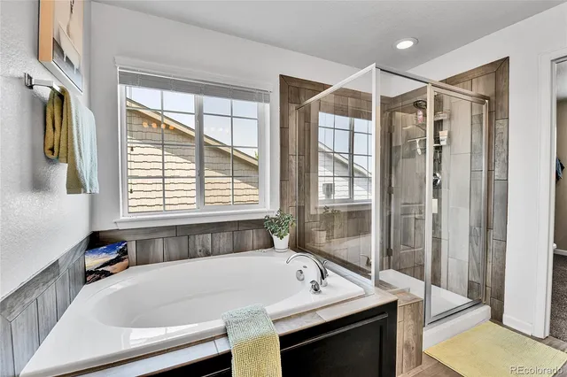 a bath tub sitting next to a window