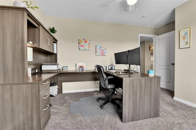 a workspace with furniture and a window