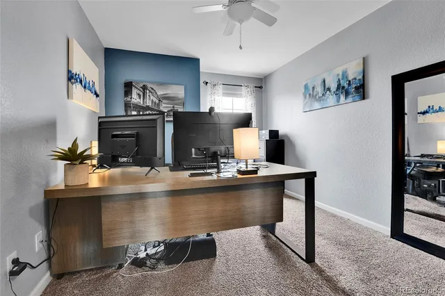 a view of a workspace with furniture