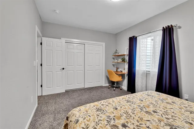 a bed room with a bed and a television