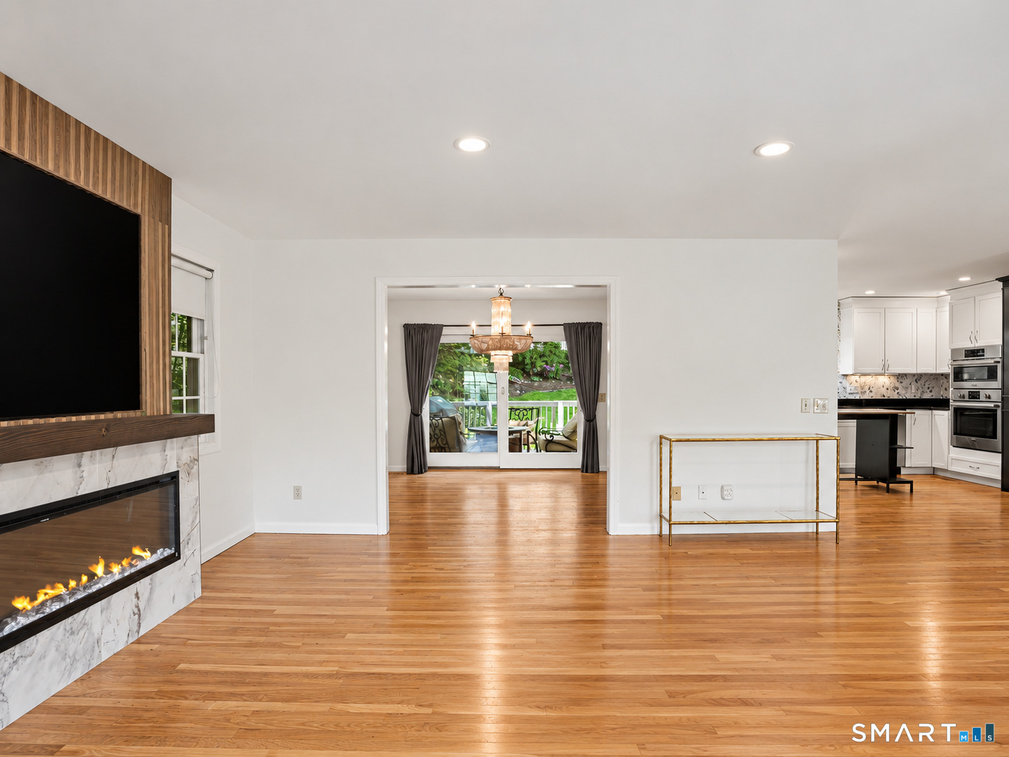 26 Abbott Avenue Ridgefield, CT 06877 - Photo 8 of 38 Living room opens into the kitchen and dining room