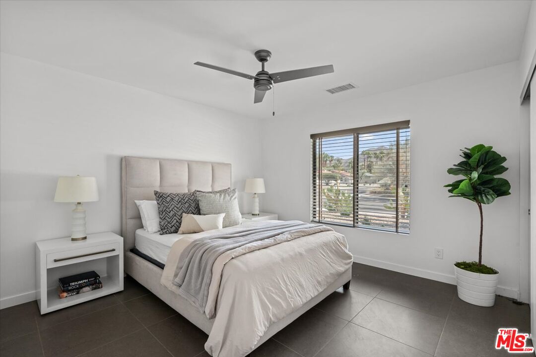 2994 Guadalupe Road Palm Springs, CA 92264 - Photo 21 of 33 a bedroom with a bed and a potted plant