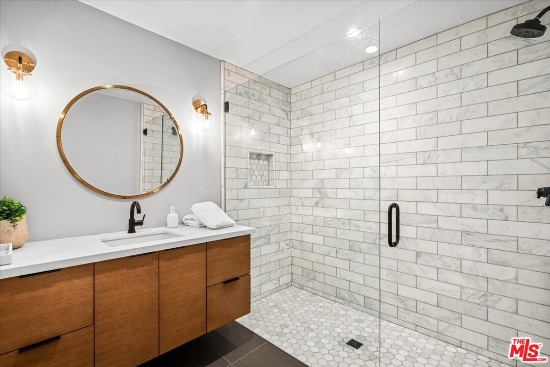 2994 Guadalupe Road Palm Springs, CA 92264 - Photo 22 of 33 a bathroom with a sink mirror and shower