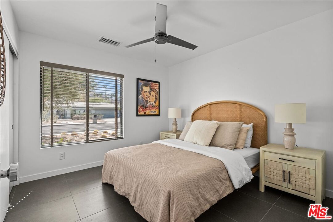 2994 Guadalupe Road Palm Springs, CA 92264 - Photo 23 of 33 a bedroom with a bed and a window