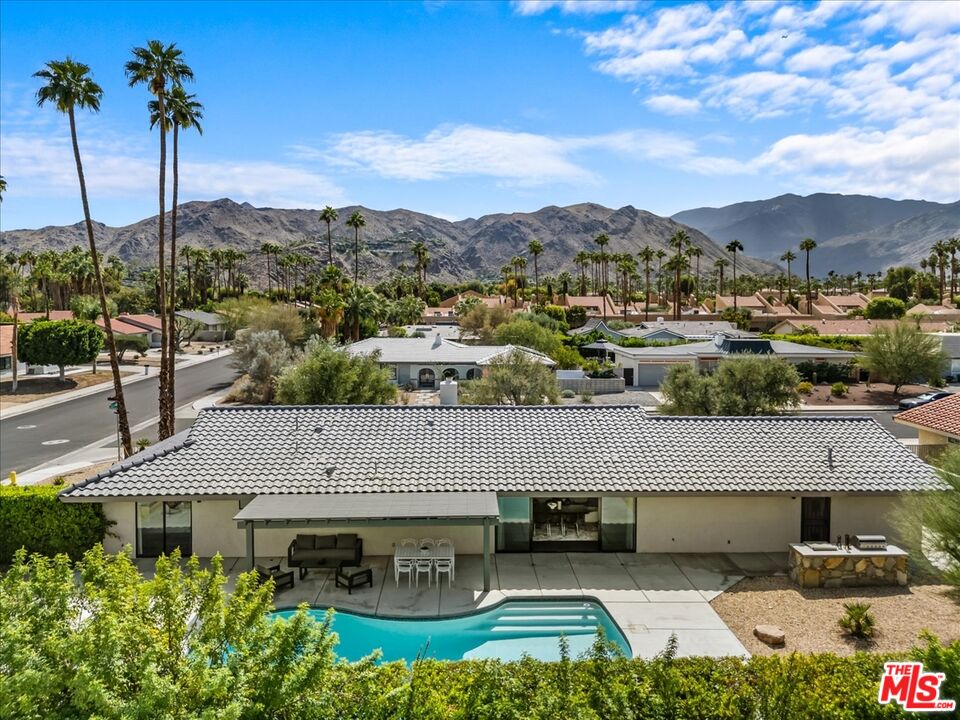 2994 Guadalupe Road Palm Springs, CA 92264 - Photo 31 of 33 an aerial view of a house with a yard and mountain view in back