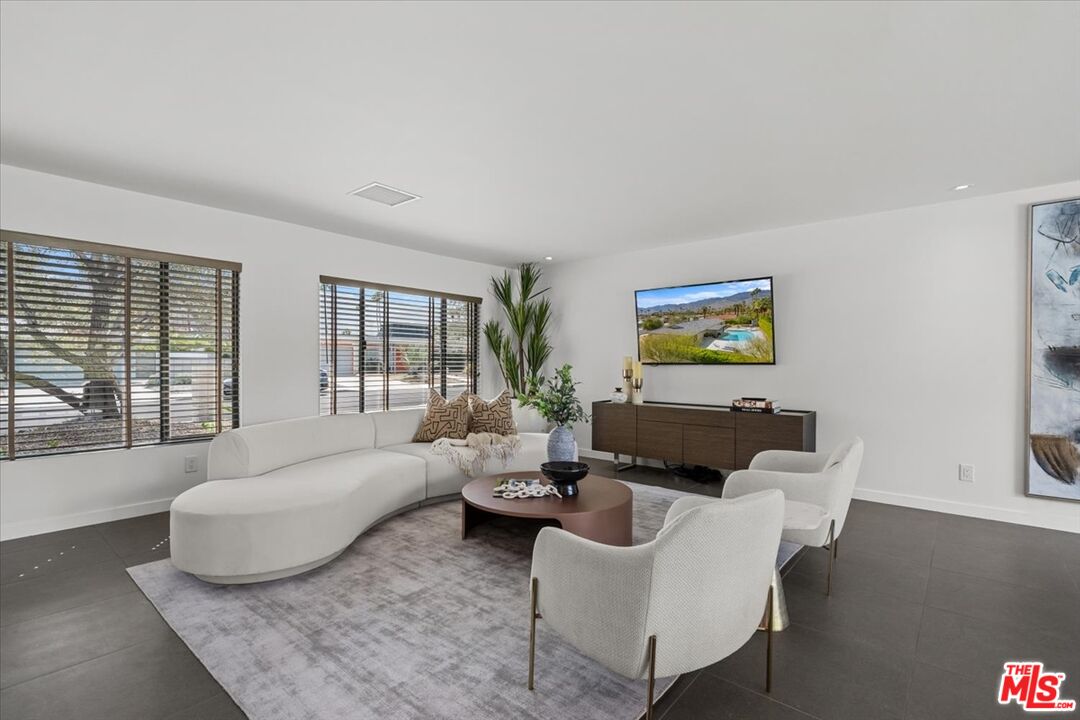 2994 Guadalupe Road Palm Springs, CA 92264 - Photo 6 of 33 a living room with furniture and a large window