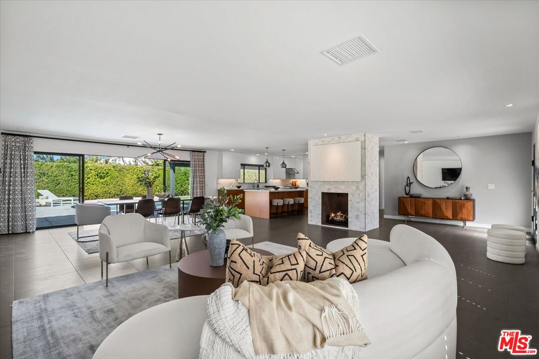 2994 Guadalupe Road Palm Springs, CA 92264 - Photo 7 of 33 a living room with fireplace furniture and a large window