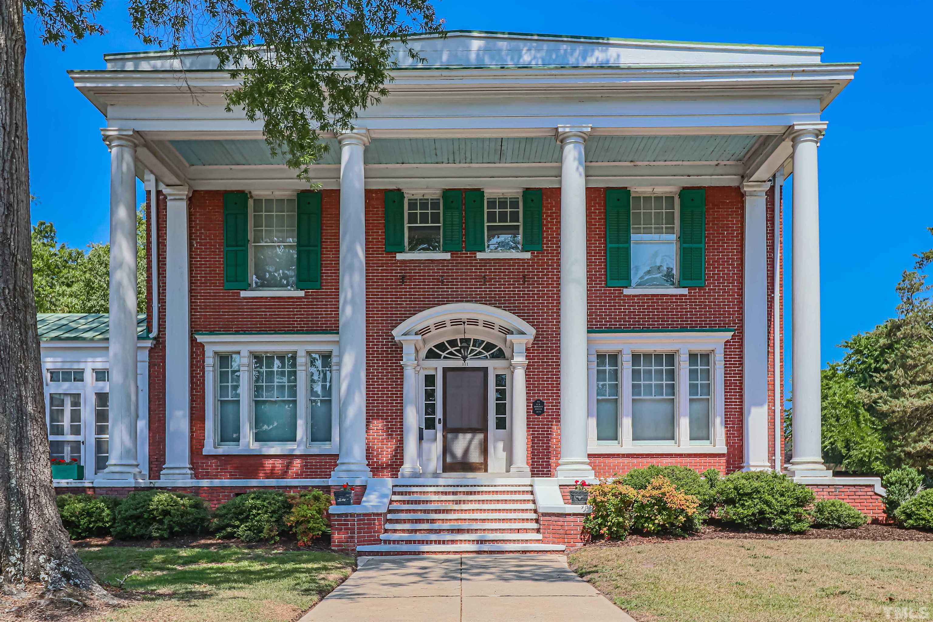111 South George Street Goldsboro, NC 27530 - Photo 1 of 51 front view of a brick house with a large windows