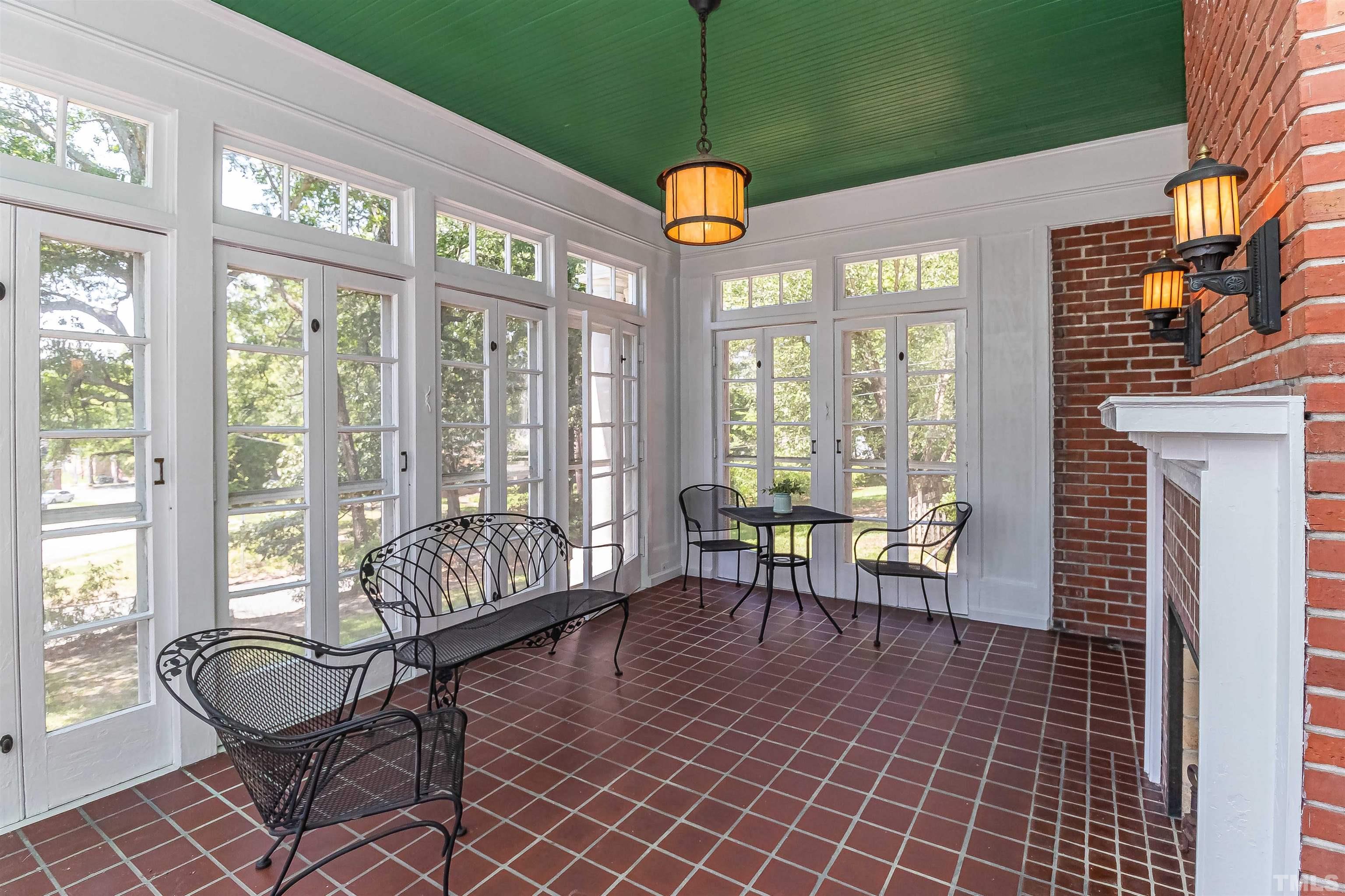 111 South George Street Goldsboro, NC 27530 - Photo 15 of 51 a dining room with furniture a chandelier and wooden floor