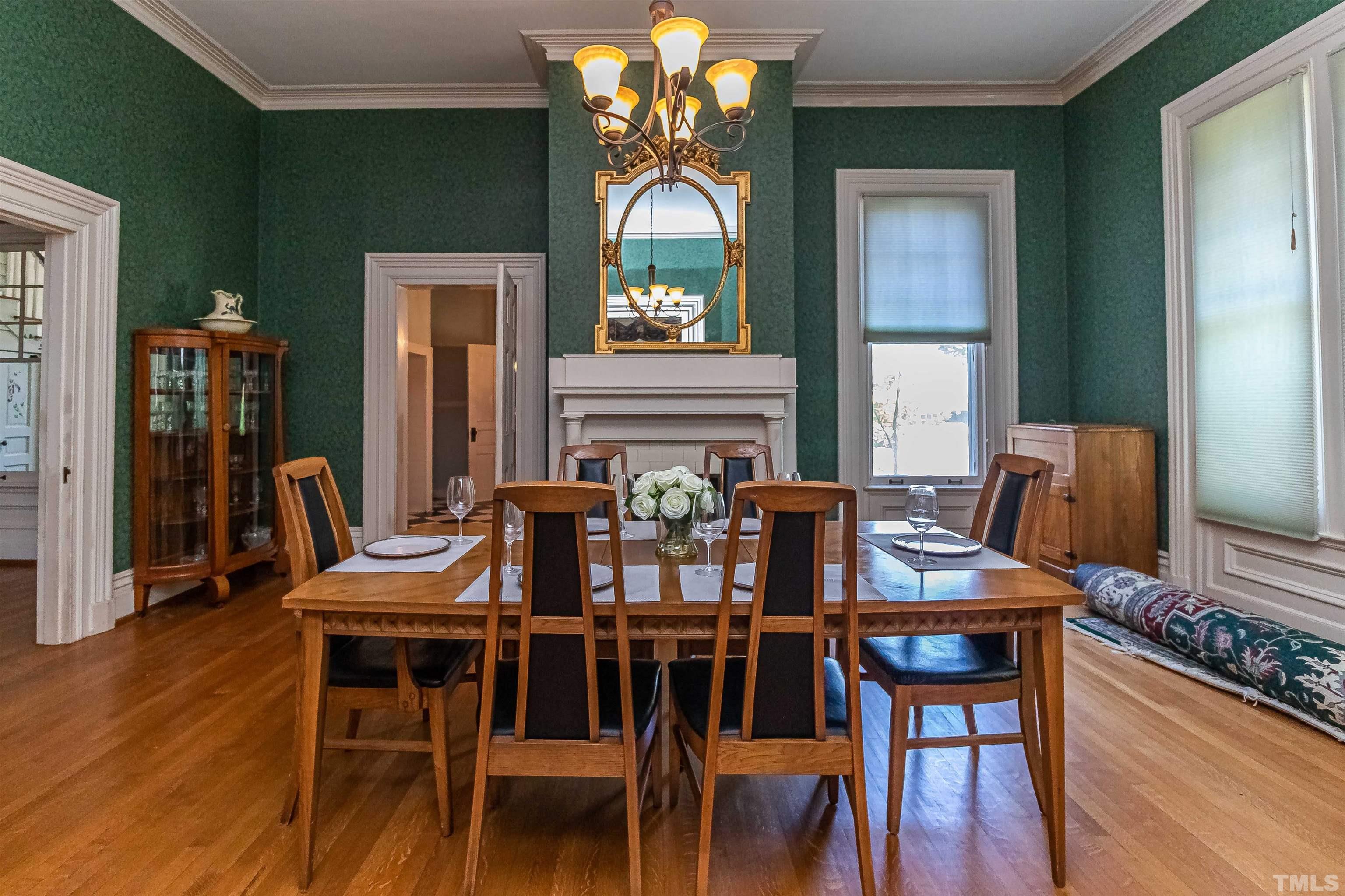 111 South George Street Goldsboro, NC 27530 - Photo 24 of 51 a view of a dining room with furniture wooden floor and chandelier