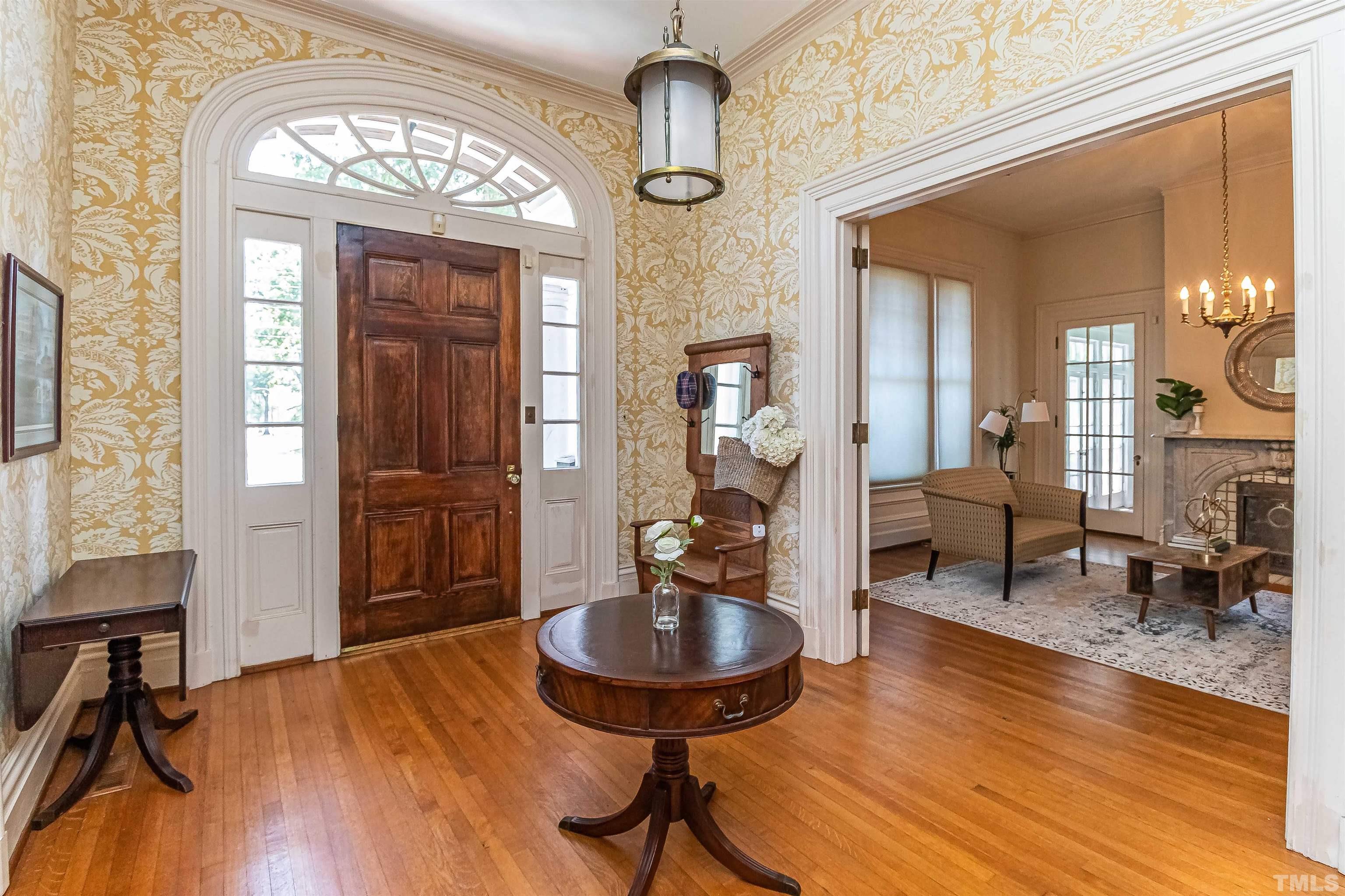 111 South George Street Goldsboro, NC 27530 - Photo 26 of 51 a living room with furniture and a wooden floor