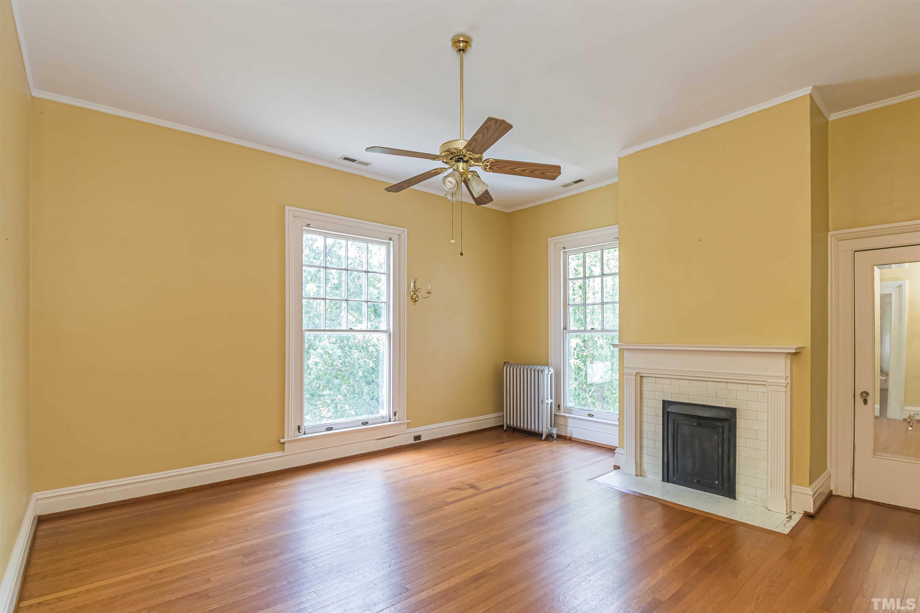 111 South George Street Goldsboro, NC 27530 - Photo 34 of 51 a view of an empty room with wooden floor and a window