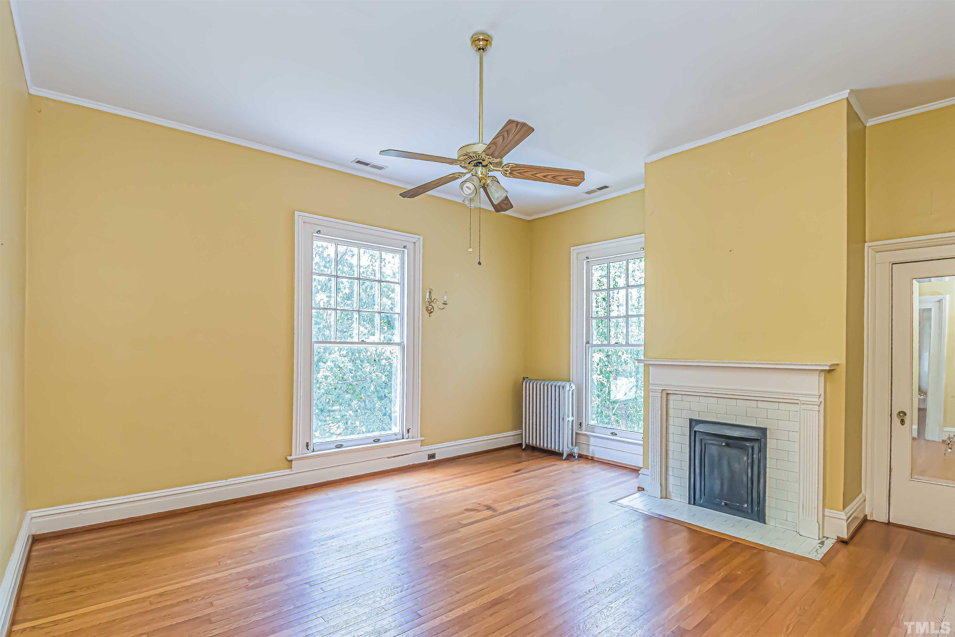111 South George Street Goldsboro, NC 27530 - Photo 35 of 51 a view of an empty room with window and wooden floor