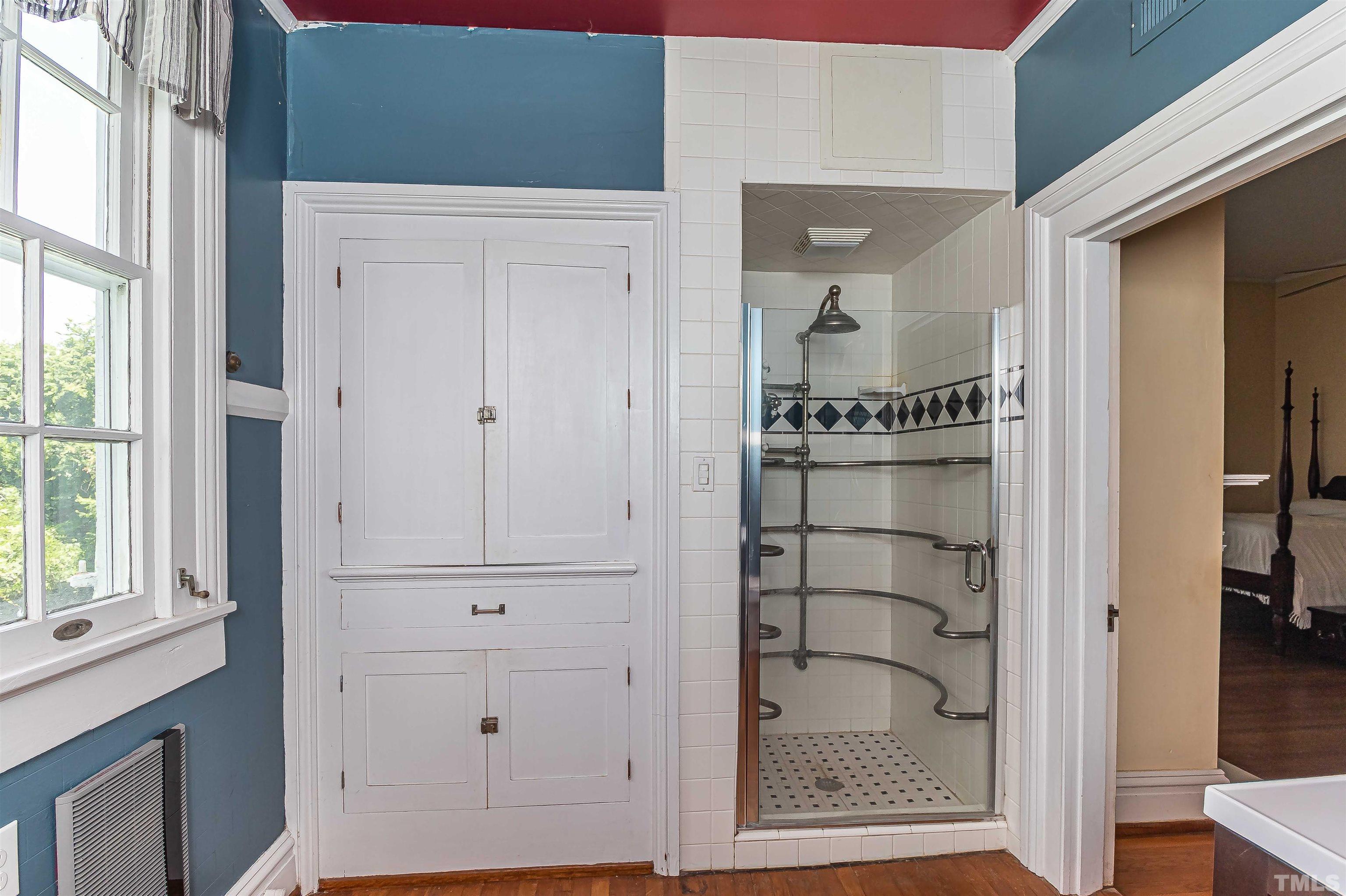 111 South George Street Goldsboro, NC 27530 - Photo 43 of 51 a view of a cabinet with cabinet and front door