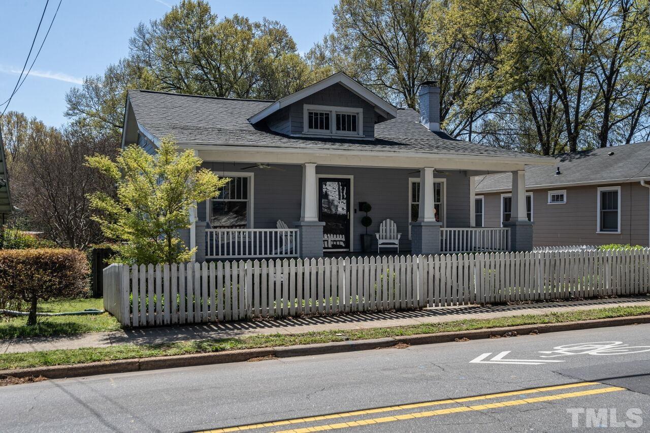 118 East Whitaker Mill Road Raleigh, NC 27608 - Photo 1 of 21 a front view of a house with a garden