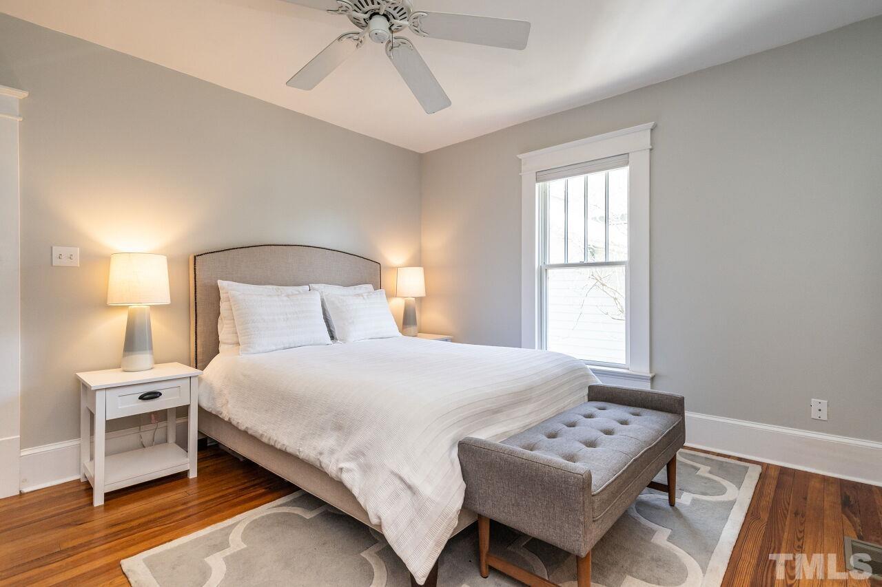 118 East Whitaker Mill Road Raleigh, NC 27608 - Photo 14 of 21 a bedroom with a bed and a window