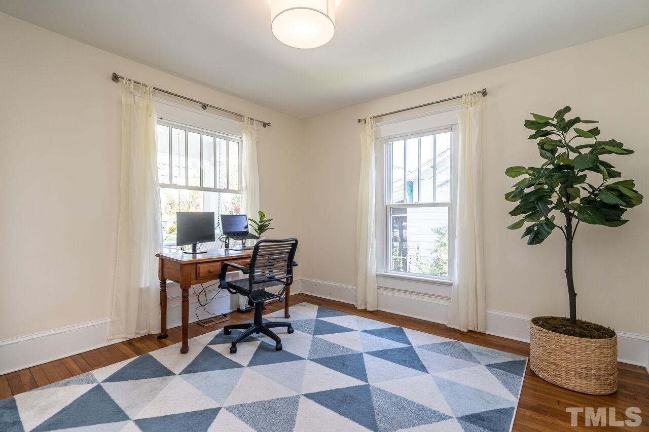 118 East Whitaker Mill Road Raleigh, NC 27608 - Photo 16 of 21 a work room with furniture and a potted plant