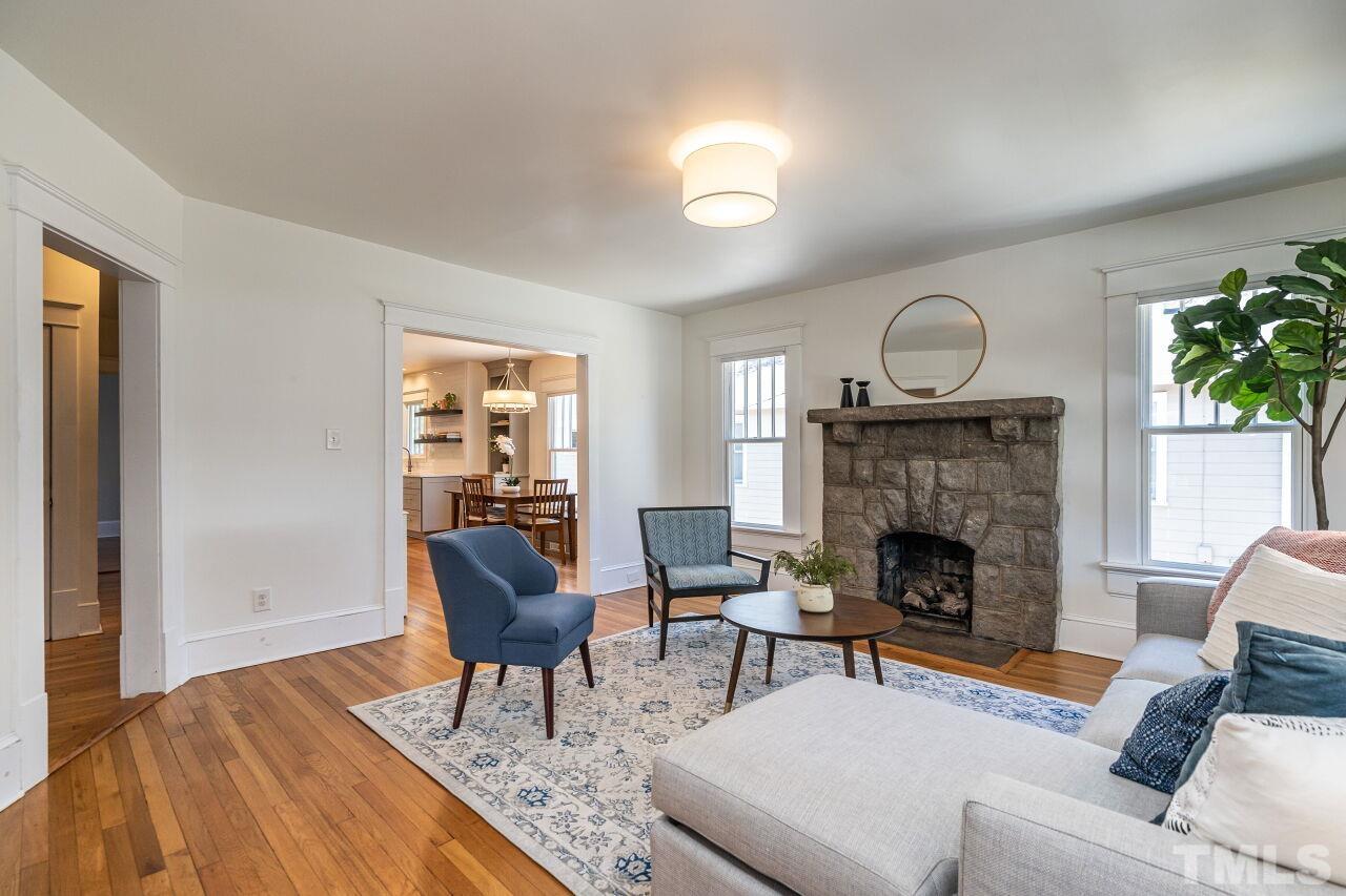 118 East Whitaker Mill Road Raleigh, NC 27608 - Photo 4 of 21 a living room with furniture and a fireplace