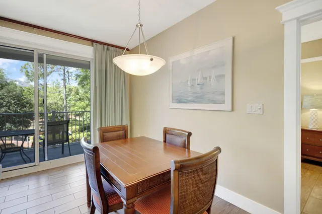 a view of a dining room with furniture window and outside view