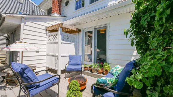a view of a chairs and table in a patio