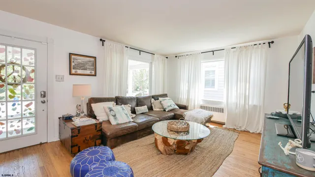 a living room with furniture and a window