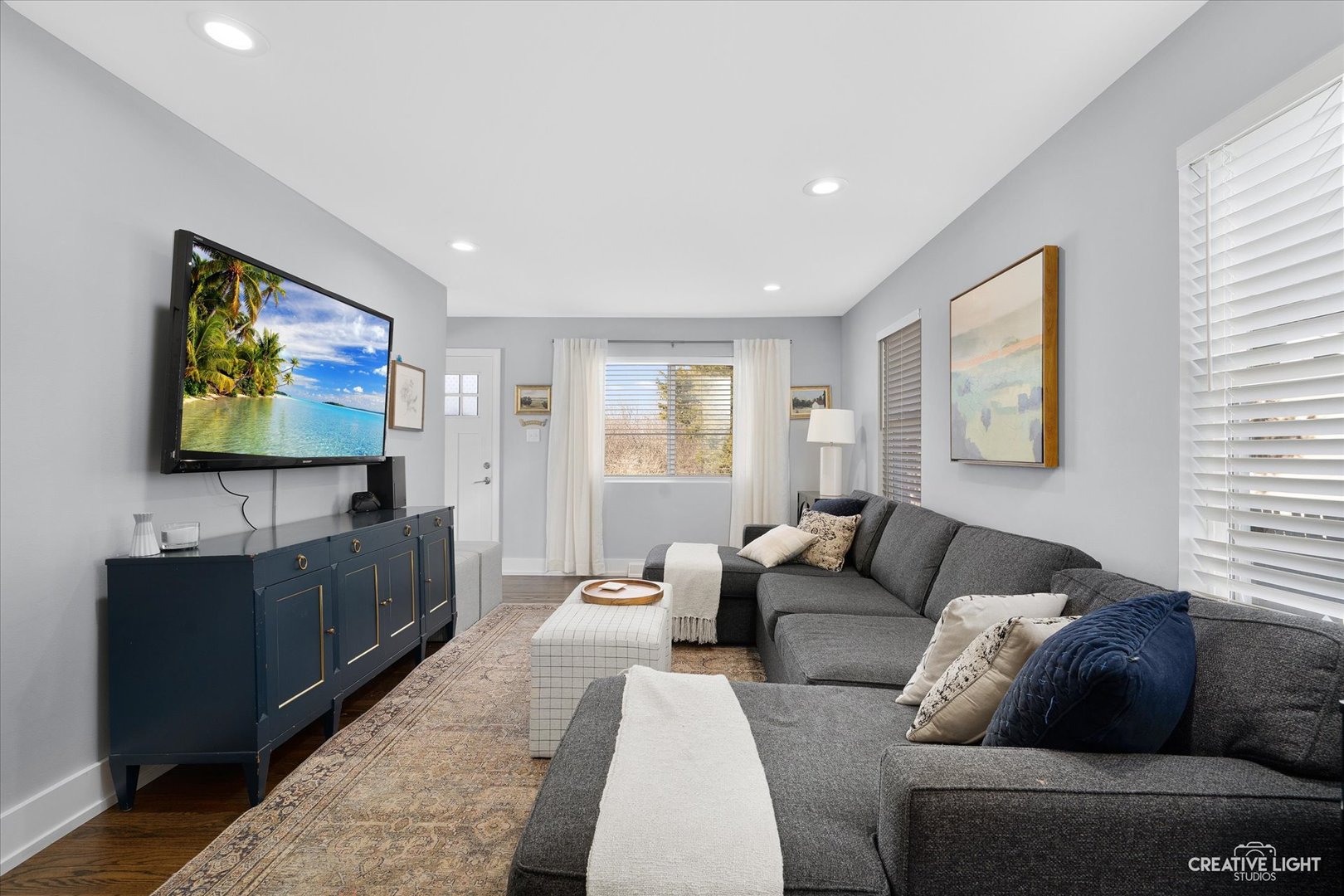 4629 Drendel Road Downers Grove, IL 60515 - Photo 6 of 28 a living room with furniture and a flat screen tv