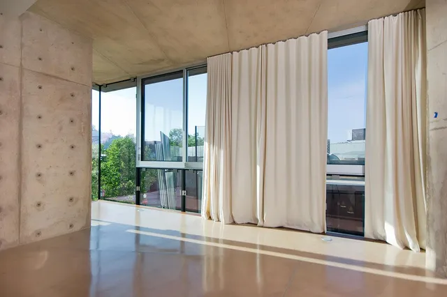 a view of a porch with a floor to ceiling window