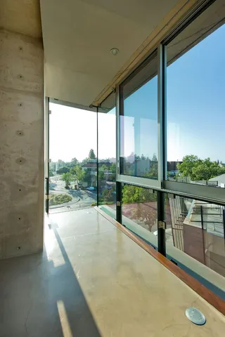 a kitchen with stainless steel appliances a sink stove and cabinets