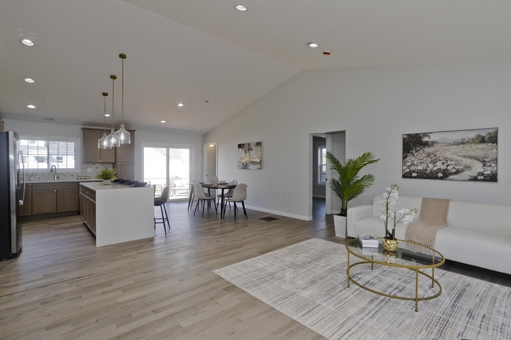 72 Lancaster Street Springfield, MA 01118 - Photo 11 of 35 a living room with furniture and wooden floor