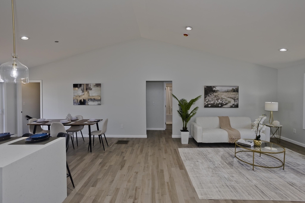 72 Lancaster Street Springfield, MA 01118 - Photo 13 of 35 a living room with furniture and wooden floor