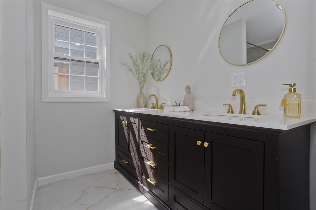 72 Lancaster Street Springfield, MA 01118 - Photo 17 of 35 a bathroom with a sink and a mirror