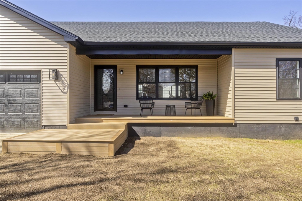 72 Lancaster Street Springfield, MA 01118 - Photo 2 of 35 a view of a white house with a swimming pool