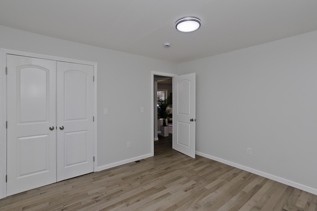 72 Lancaster Street Springfield, MA 01118 - Photo 21 of 35 a view of an empty room with wooden floor