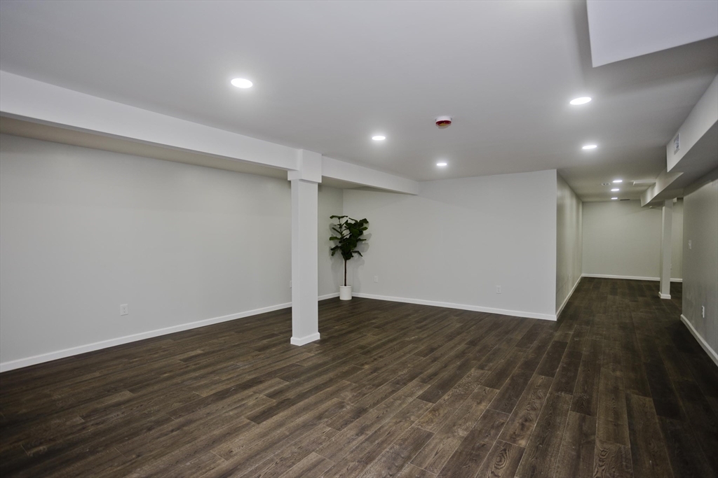 72 Lancaster Street Springfield, MA 01118 - Photo 23 of 35 a view of an empty room with wooden floor