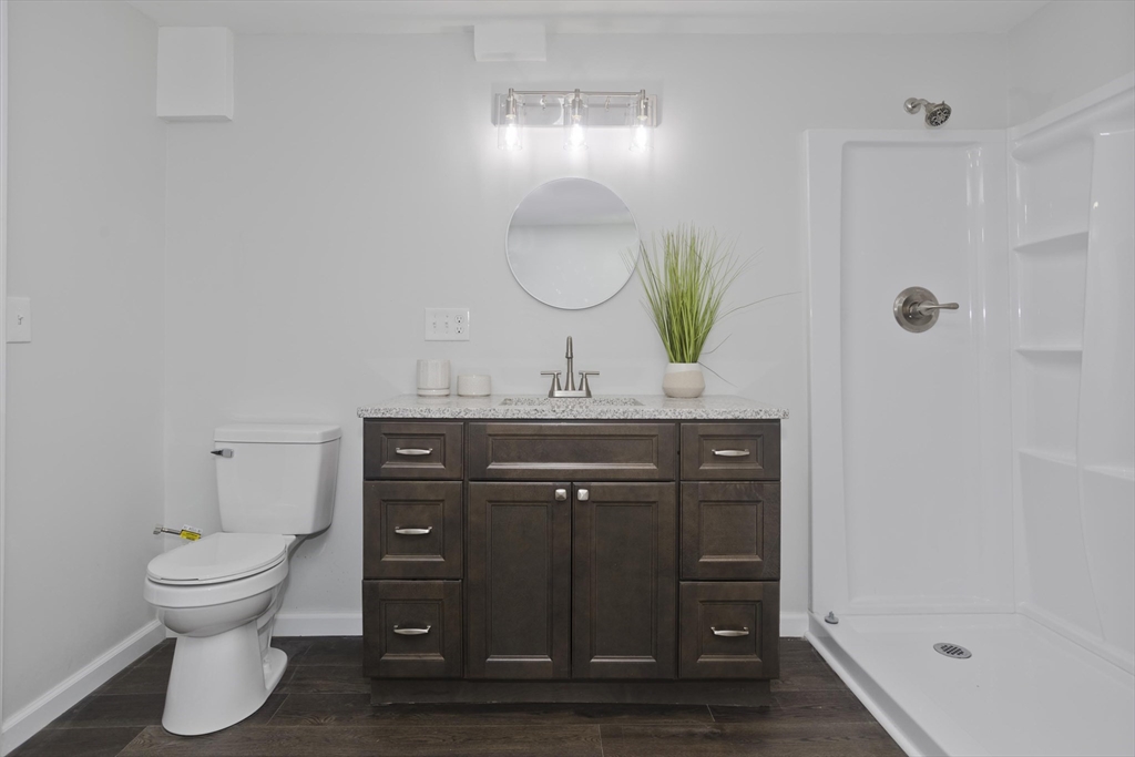 72 Lancaster Street Springfield, MA 01118 - Photo 29 of 35 a bathroom with a sink vanity and a mirror