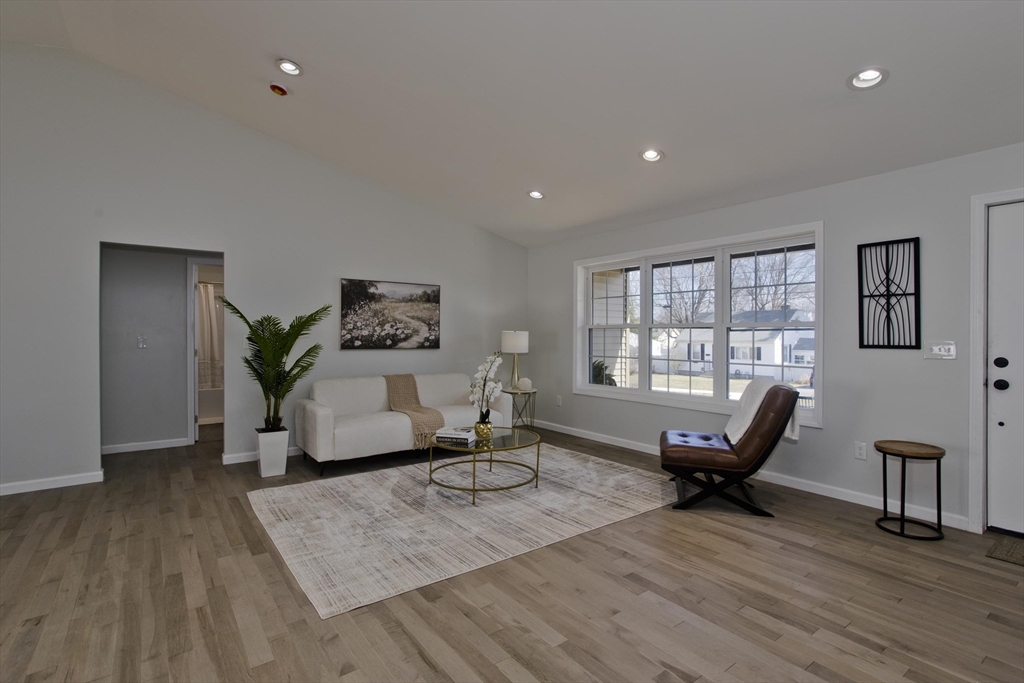 72 Lancaster Street Springfield, MA 01118 - Photo 9 of 35 a living room with furniture window and wooden floor