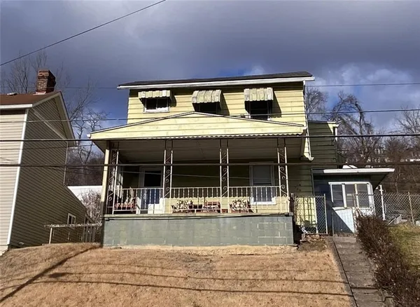a view of house with outdoor space